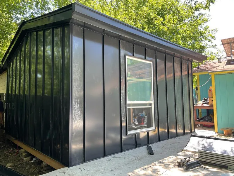 Black standing seam metal wall panels for Roof Inspection in Timnath