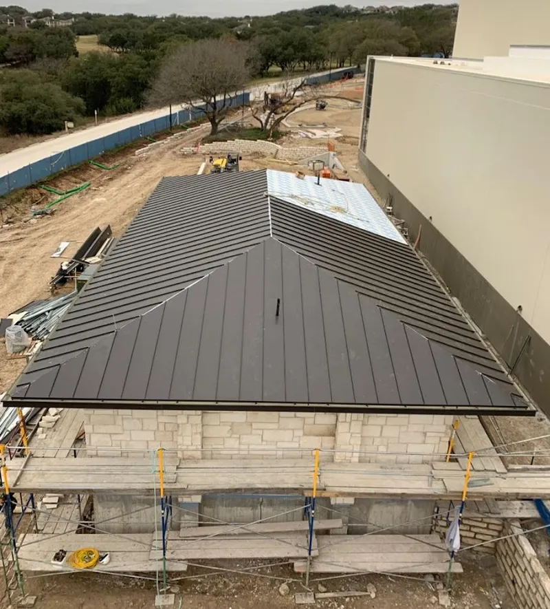 Metal roof new construction with scaffolding in Timnath