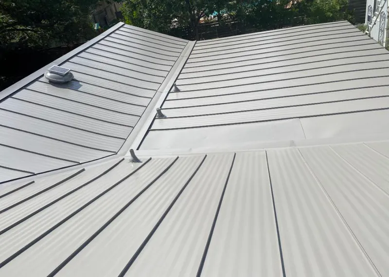 Solar attic fan installed on a metal roof for Roof Ventilation in Timnath